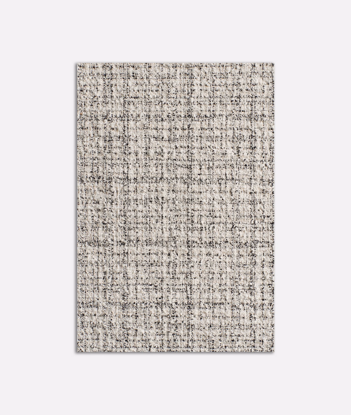 Pale greige tweed upholstery with charcoal flecks and irregular woven checks