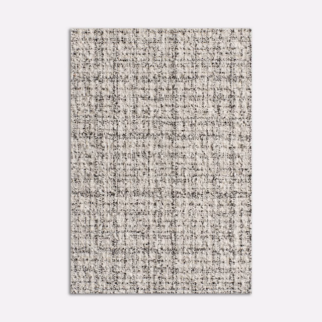 Pale greige tweed upholstery with charcoal flecks and irregular woven checks