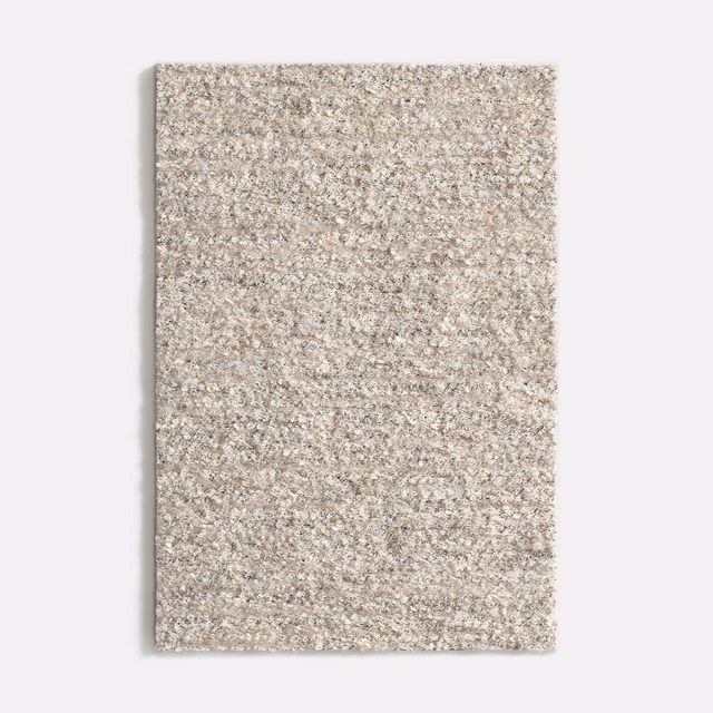 Pale pumice taupe upholstery swatch with a flecked, nubby woven texture