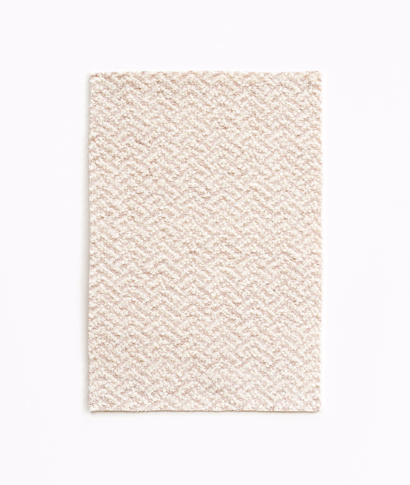Pale blush and ivory woven swatch with a fine diagonal chevron texture