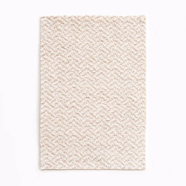 Pale blush and ivory woven swatch with a fine diagonal chevron texture