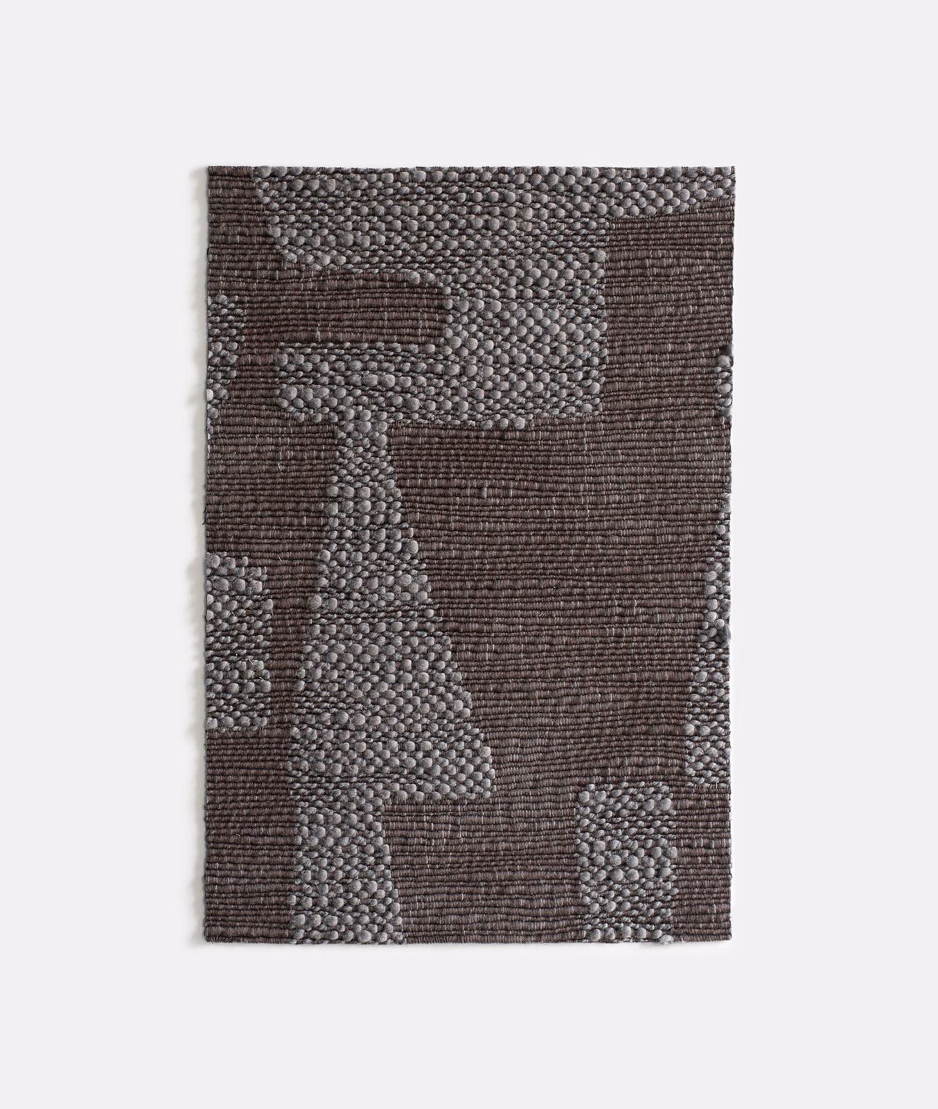 Charcoal-brown and grey geometric upholstery weave with raised, nubby texture