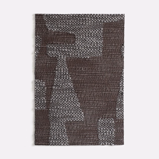 Charcoal-brown and grey geometric upholstery weave with raised, nubby texture