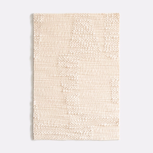 Pale kaolin cream textile with irregular horizontal woven bands and tactile loops