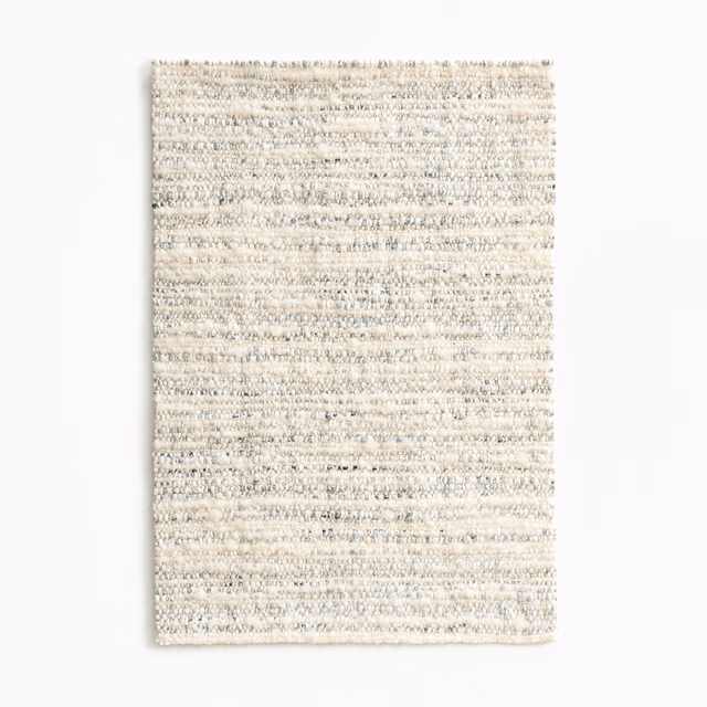 Pale greige Vuk fabric swatch with irregular horizontal nubby weave and grey flecks