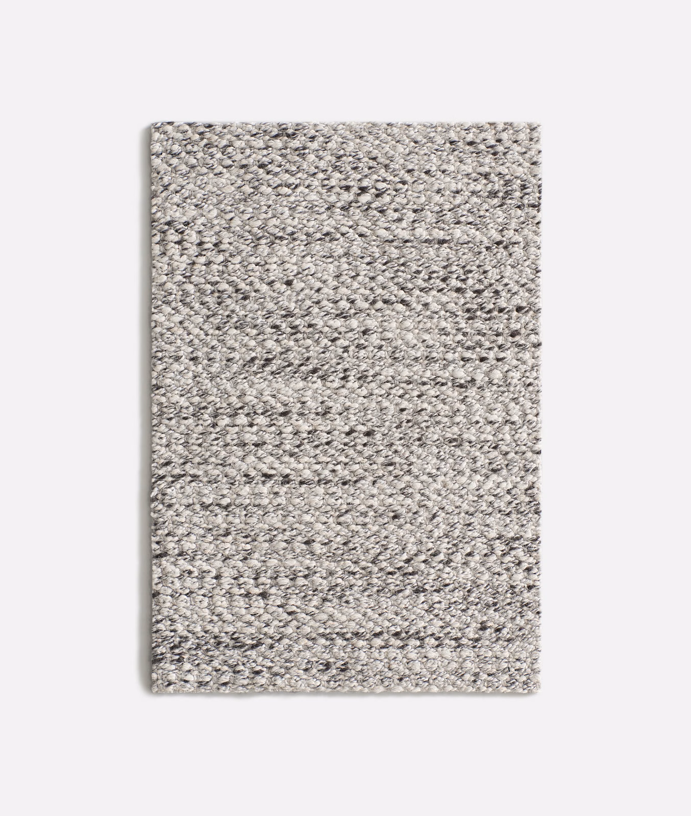 Dense nubby weave in cool mottled grey with charcoal and off-white flecks