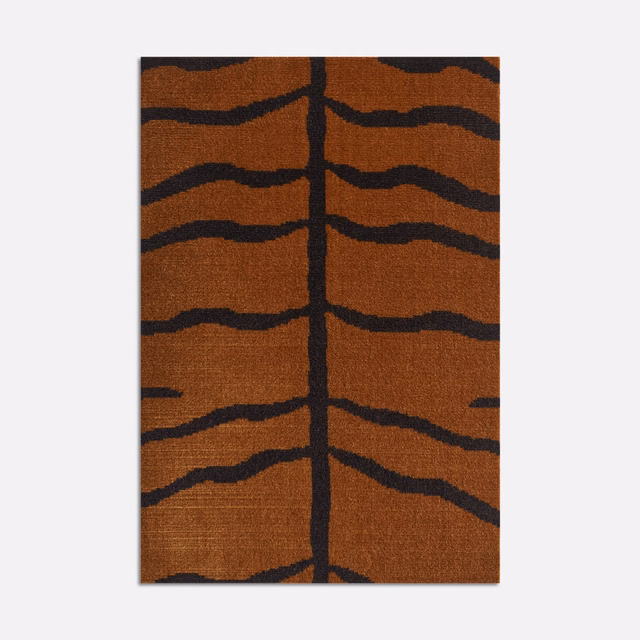 Burnt-orange velvet with charcoal branching stripes and a central dark stem