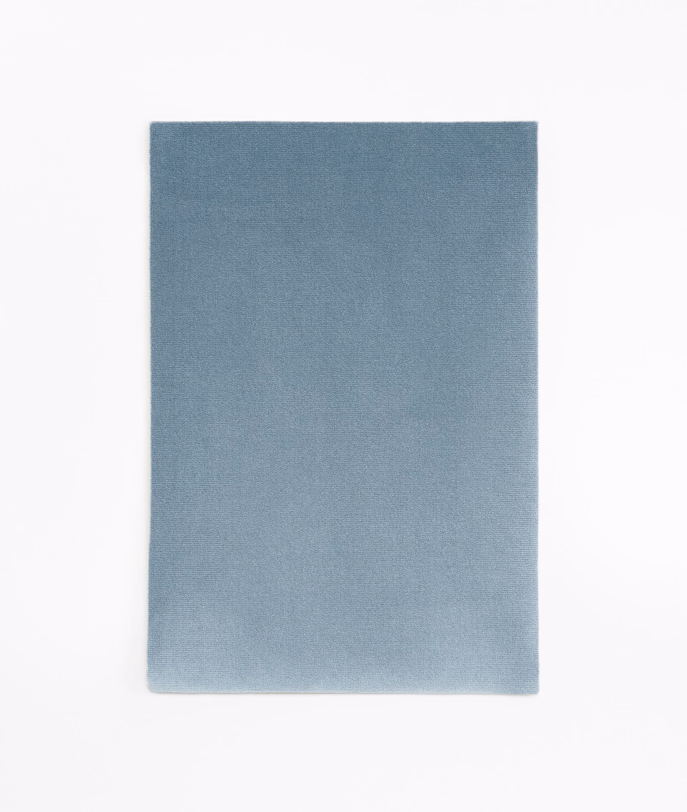 Muted blue-grey velvet swatch with an even, softly light-catching pile