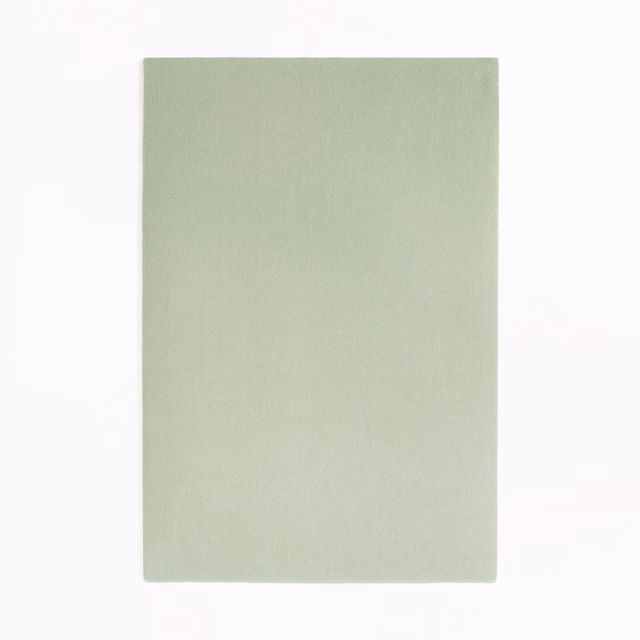 Pale sage-green velvet swatch with a smooth nap and subtle tonal shading