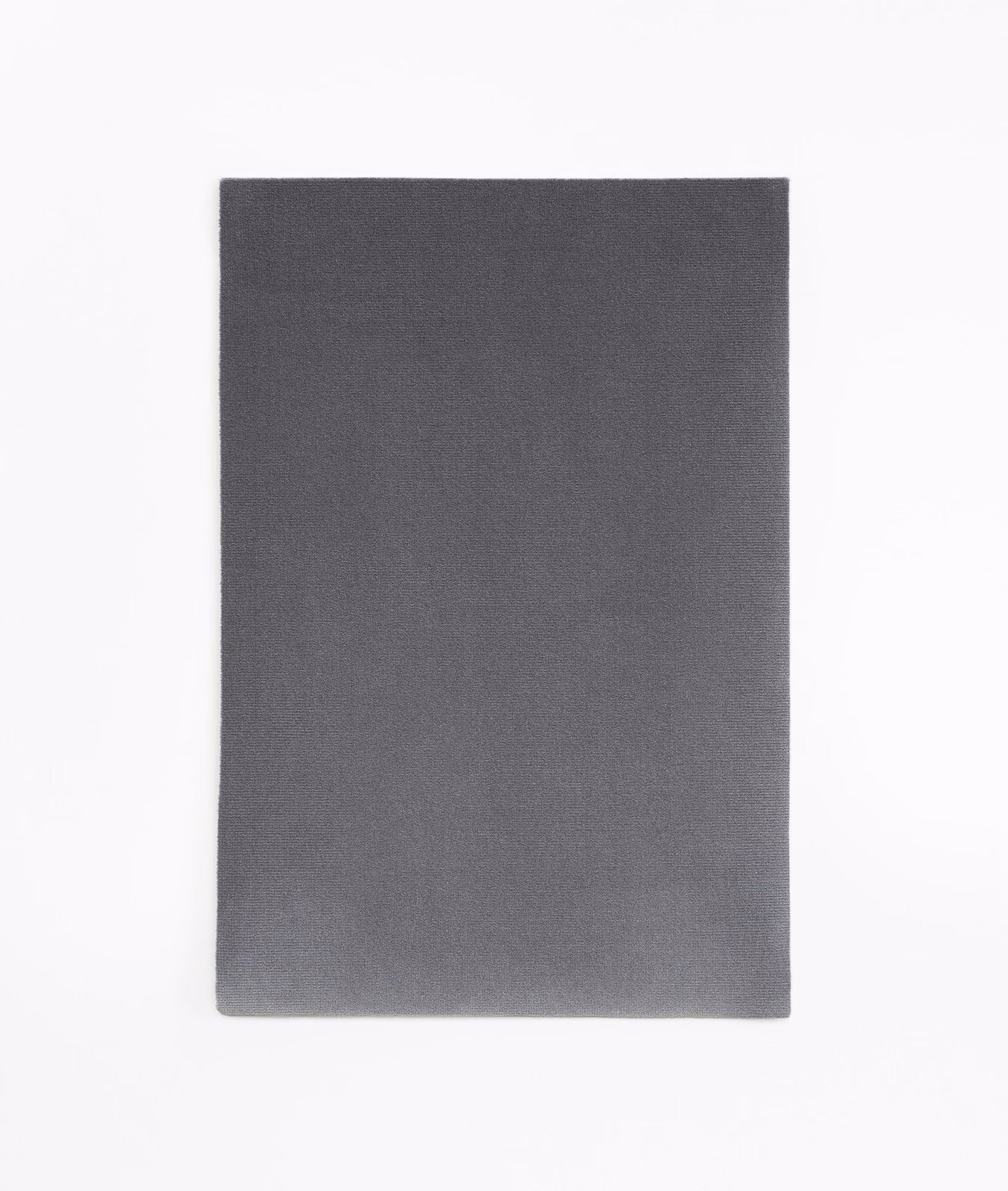 Smooth anthracite velvet with a subtly light-catching pile and charcoal-grey surface