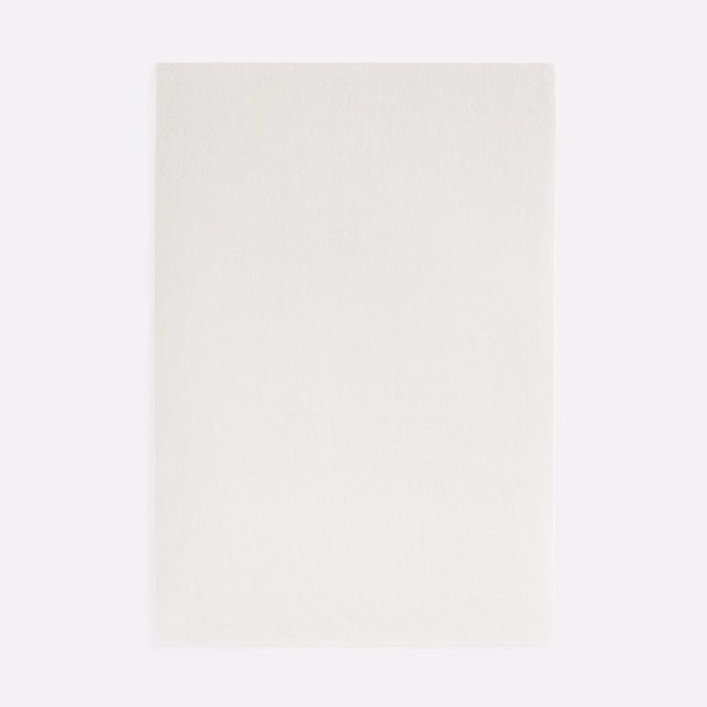 Soft ivory-white velvet swatch with a subtly brushed, lightly textured surface