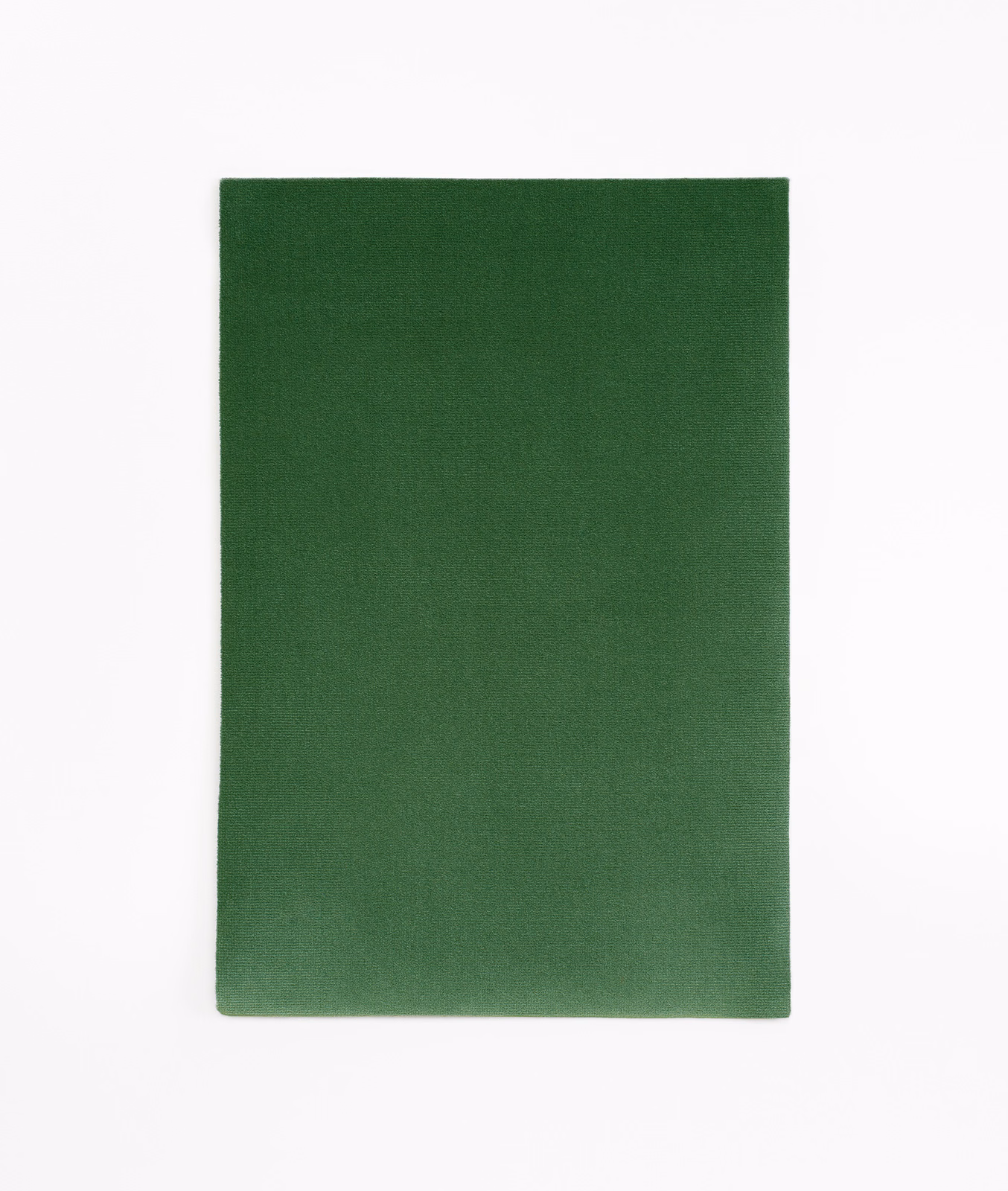 Deep bottle-green velvet swatch with a softly shifting, close-cut pile