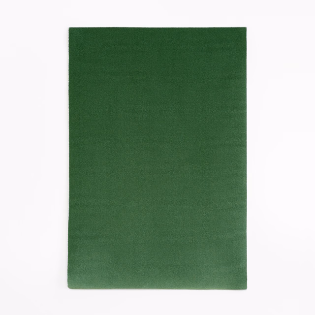 Deep bottle-green velvet swatch with a softly shifting, close-cut pile