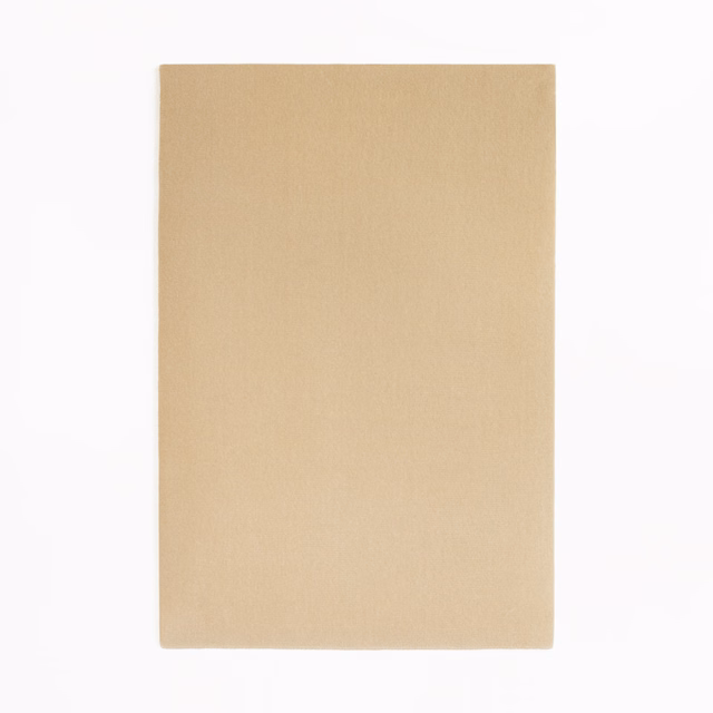 Warm dune-beige velvet swatch with a smooth, subtly directional nap