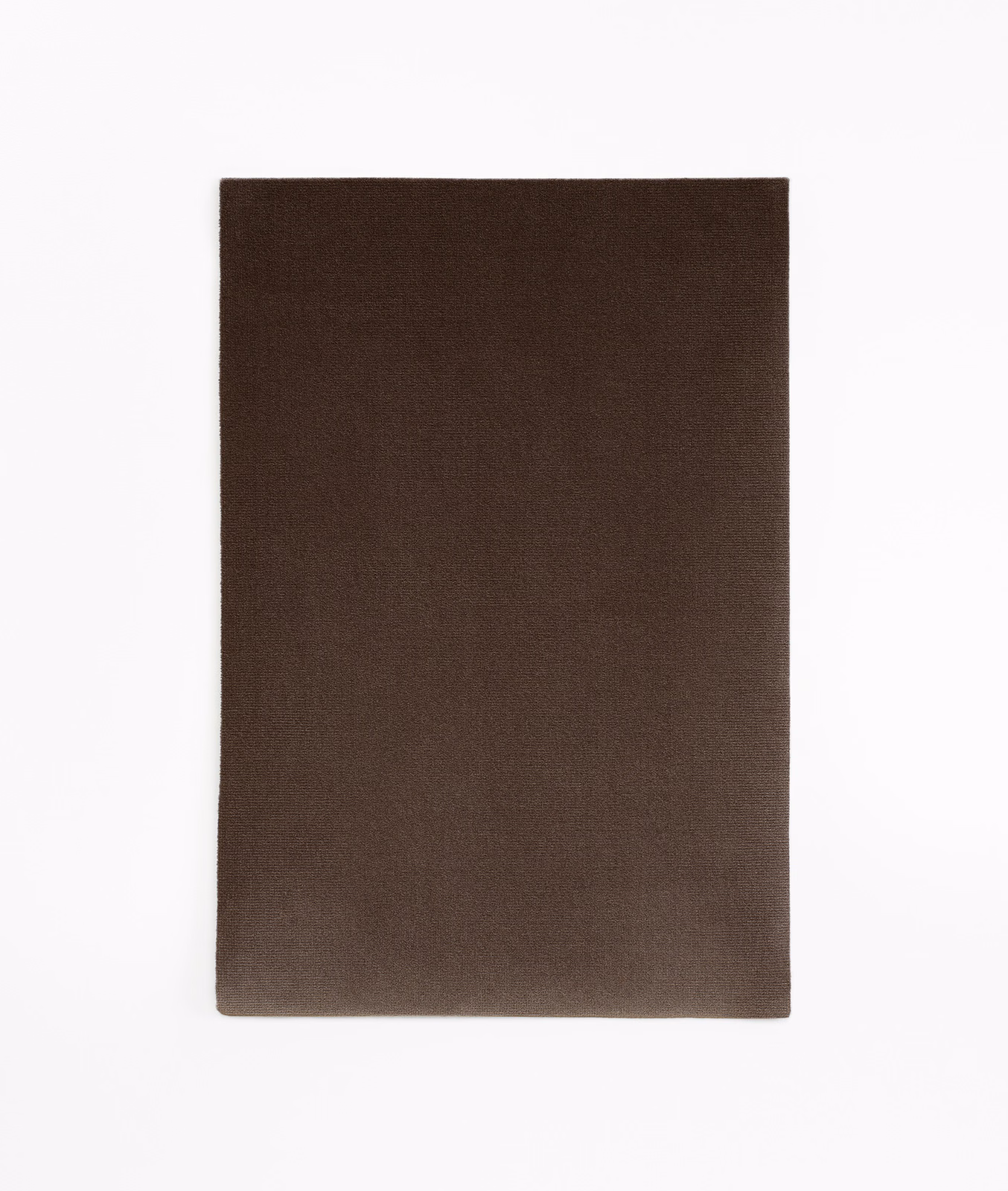 Deep espresso-brown velvet swatch showing a subtle light-catching nap