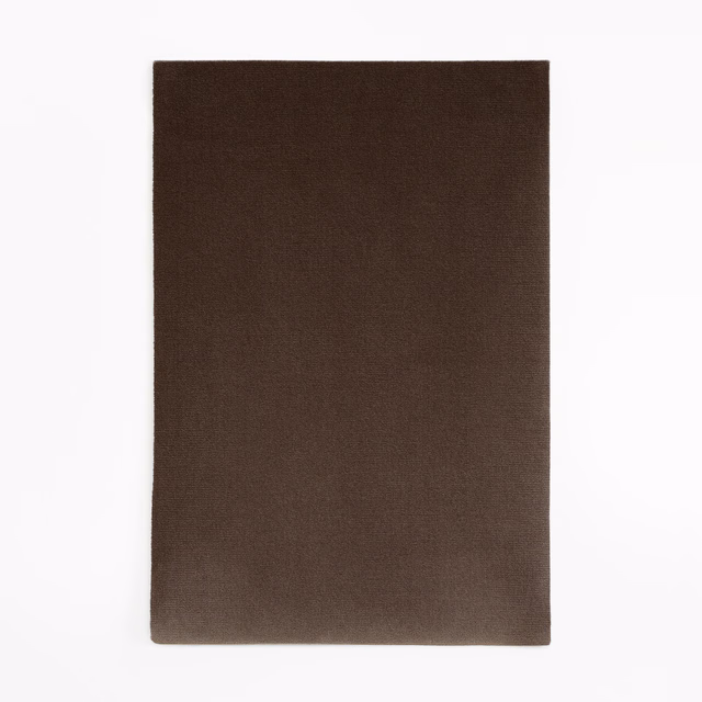 Deep espresso-brown velvet swatch showing a subtle light-catching nap