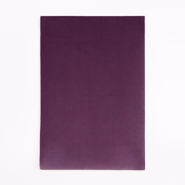 Deep aubergine-purple velvet swatch with a subtle, softly light-catching nap