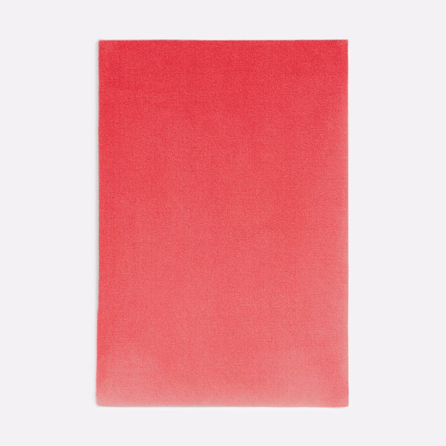 Geranium-red velvet swatch with soft coral shading and a subtle directional nap