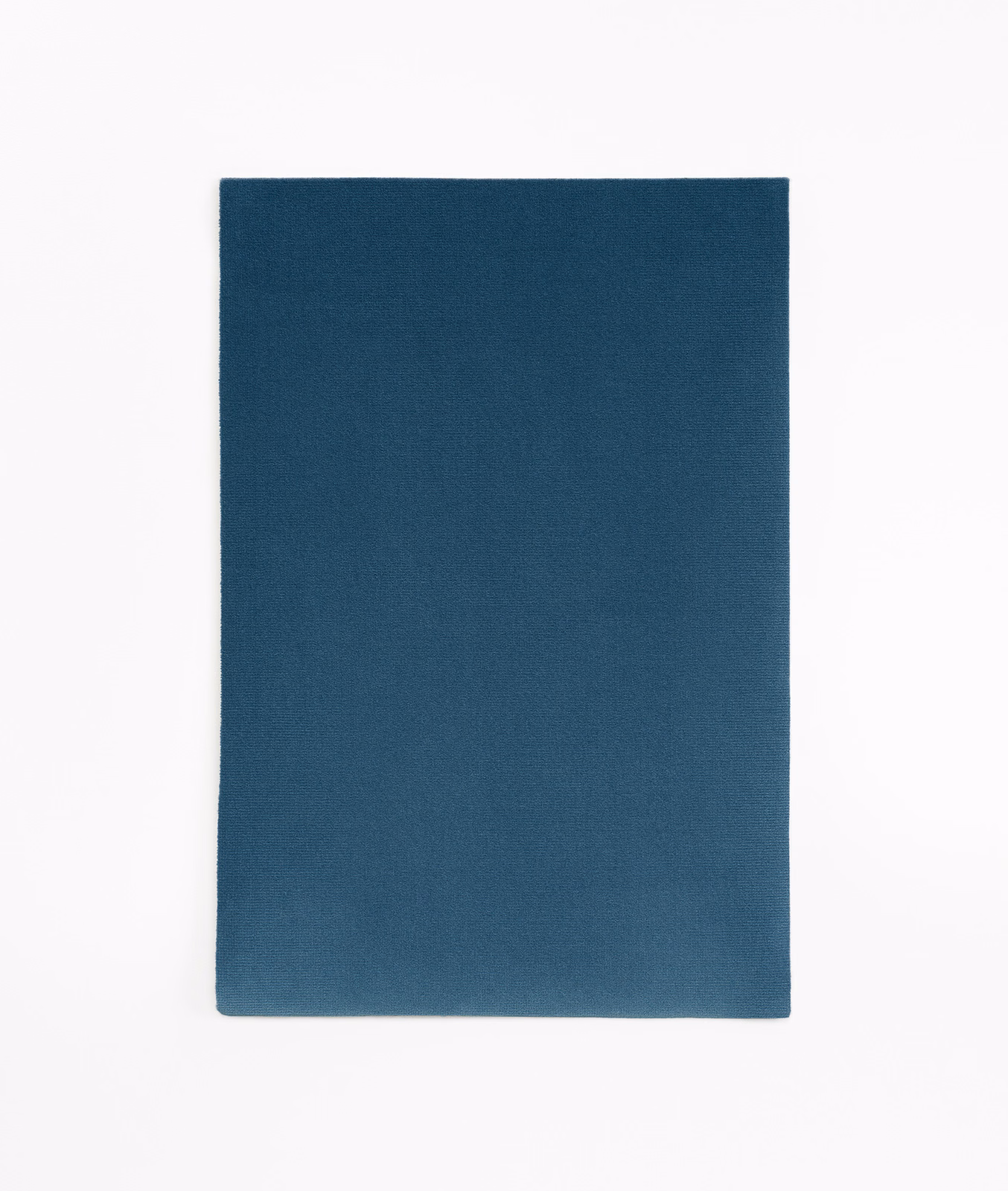 Deep indigo-blue velvet swatch showing a soft, subtly shifting pile