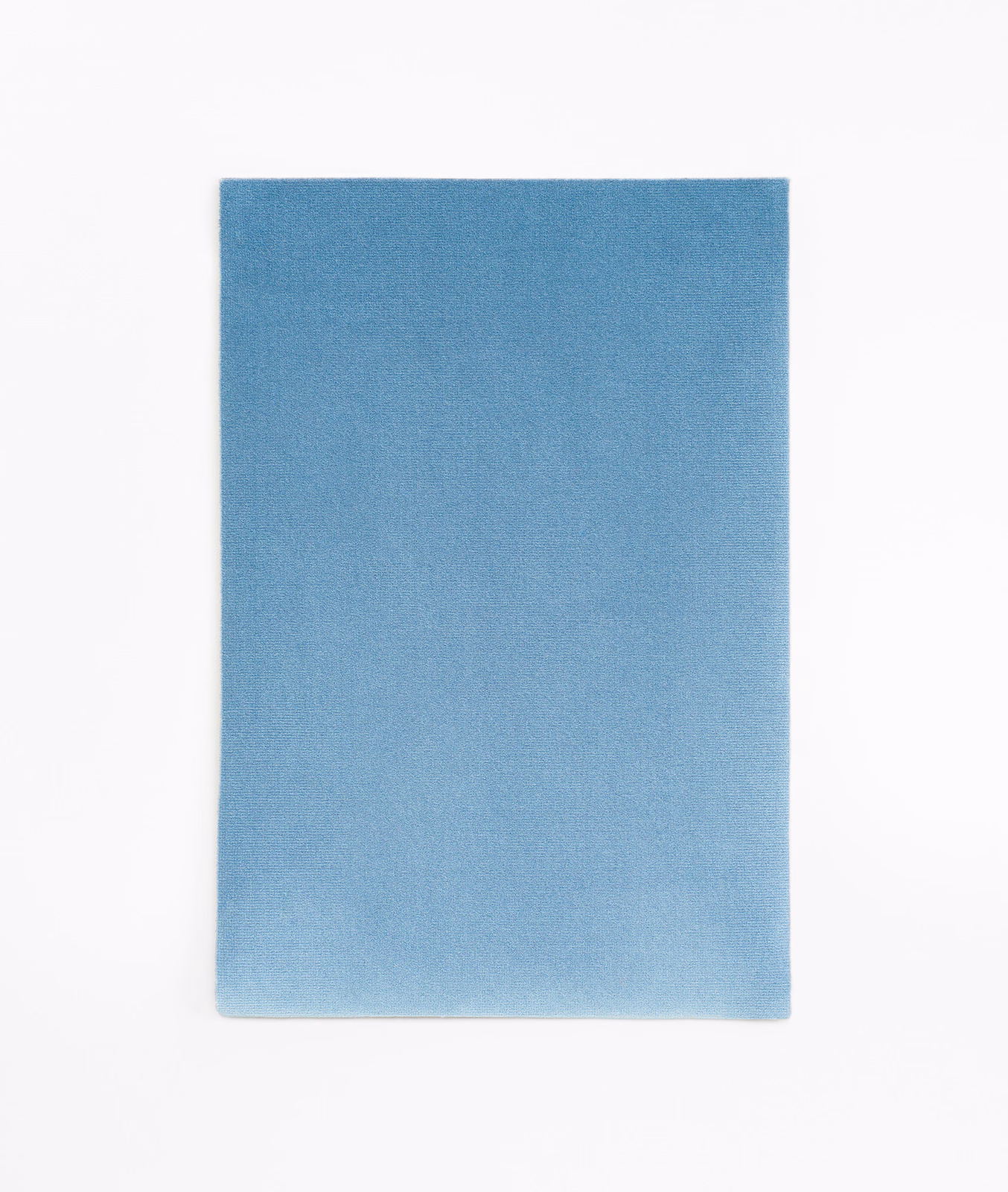 Plain denim-blue velvet swatch with soft nap and subtle blue-grey shading