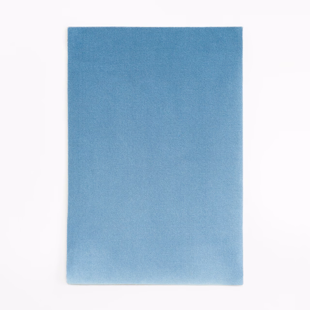 Plain denim-blue velvet swatch with soft nap and subtle blue-grey shading
