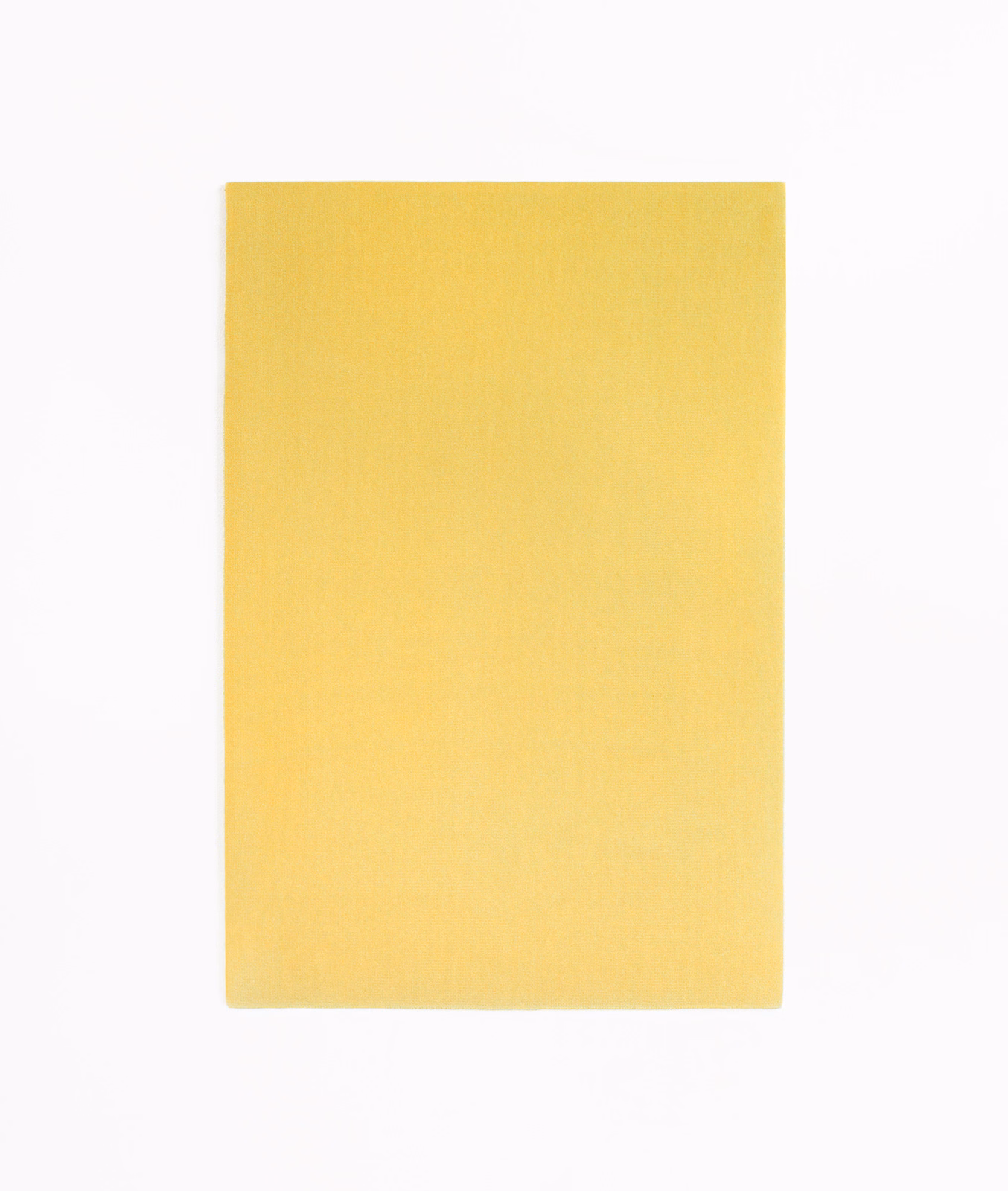 Lemon-yellow velvet swatch showing a softly shaded, fine directional pile