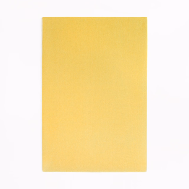 Lemon-yellow velvet swatch showing a softly shaded, fine directional pile