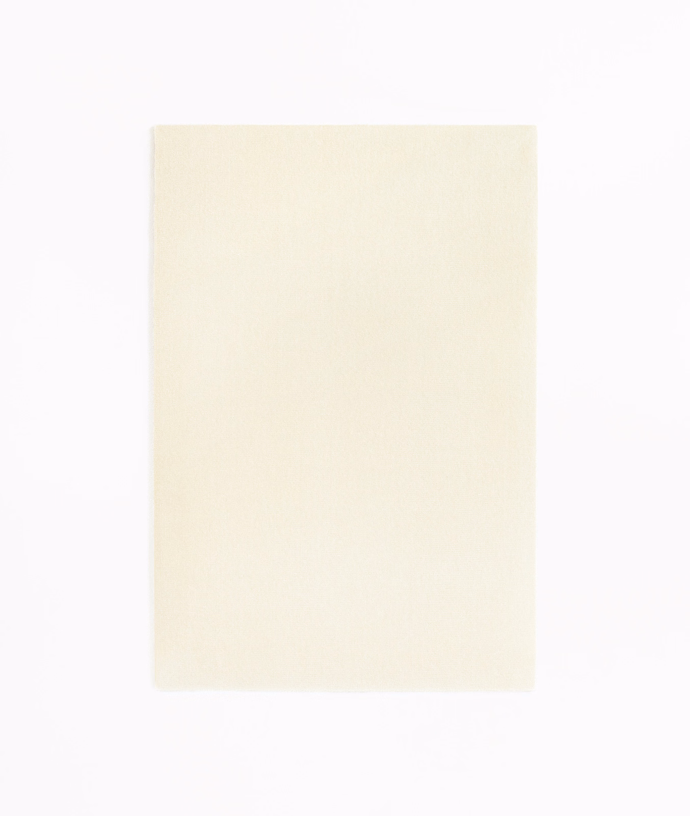 Pale ivory velvet swatch with a soft, even nap and subtly luminous surface