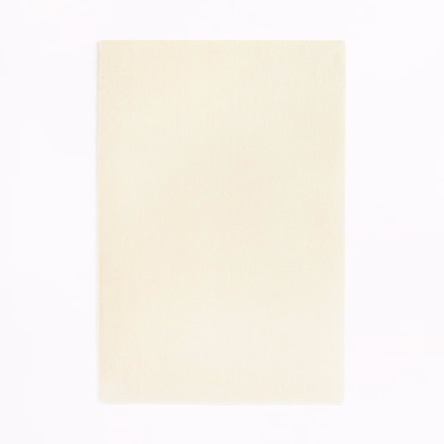Pale ivory velvet swatch with a soft, even nap and subtly luminous surface