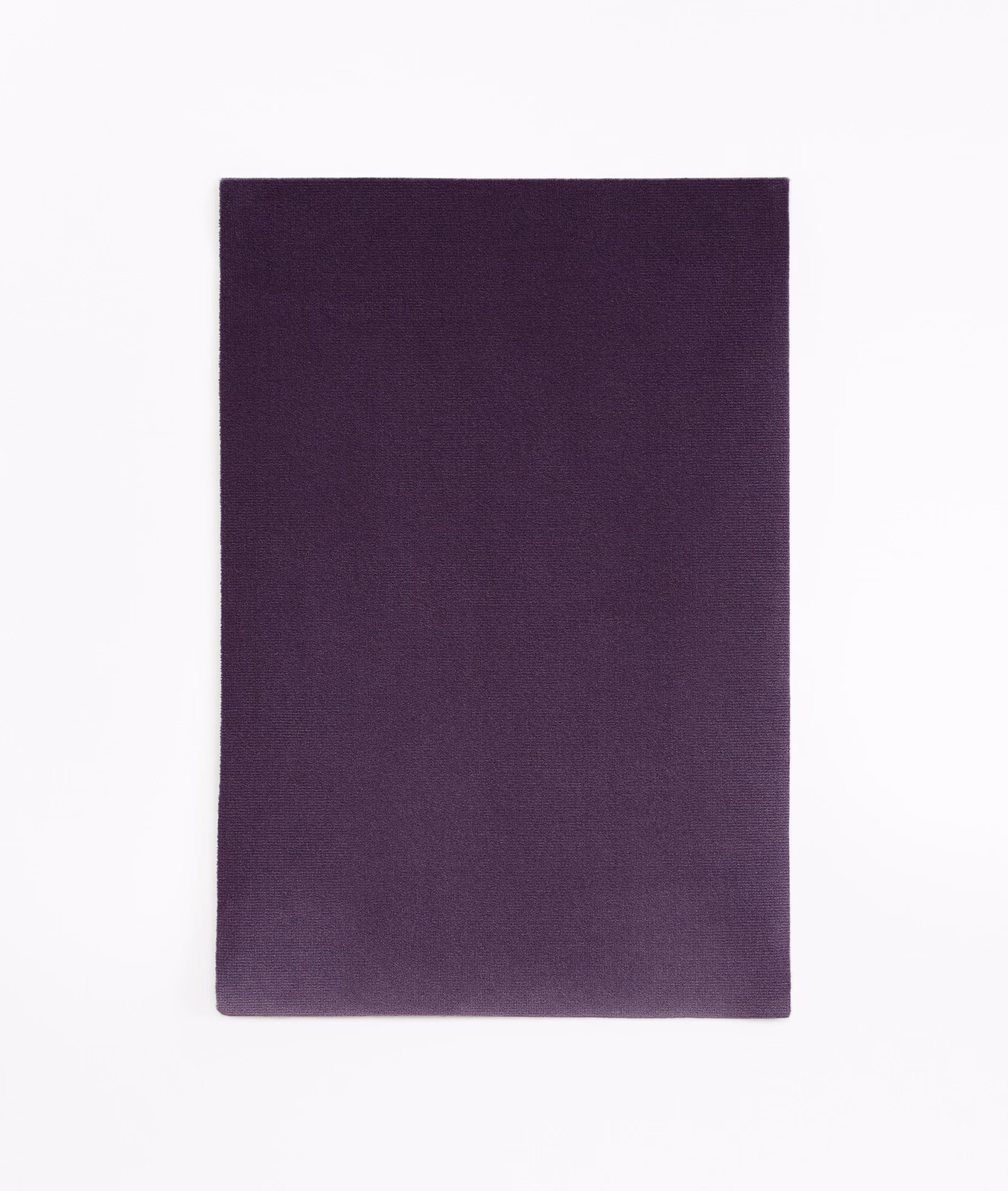 Deep aubergine-purple velvet swatch with subtle nap shading across a plain surface