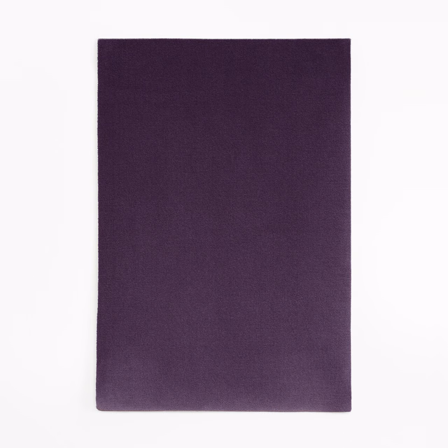 Deep aubergine-purple velvet swatch with subtle nap shading across a plain surface