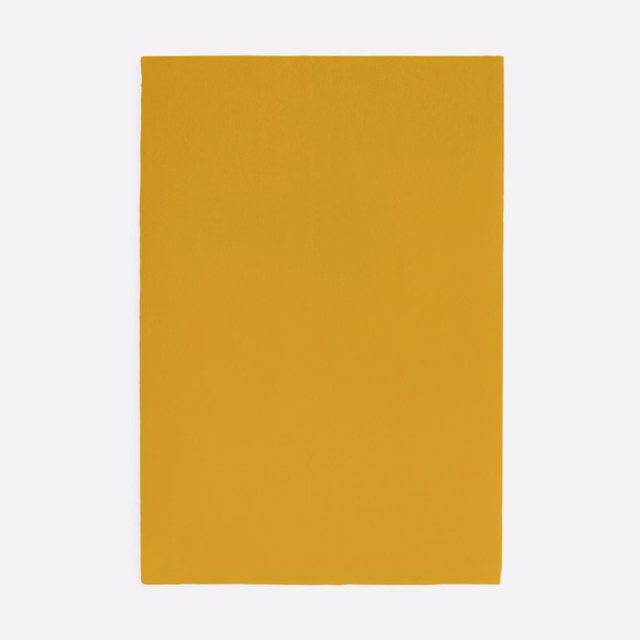 Warm mustard-yellow velvet swatch with smooth surface and subtle tonal nap