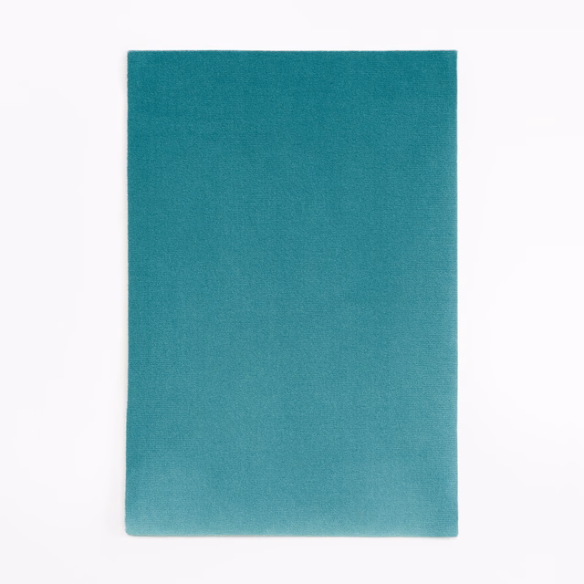 Saturated ocean-teal velvet swatch with an even nap and soft directional sheen