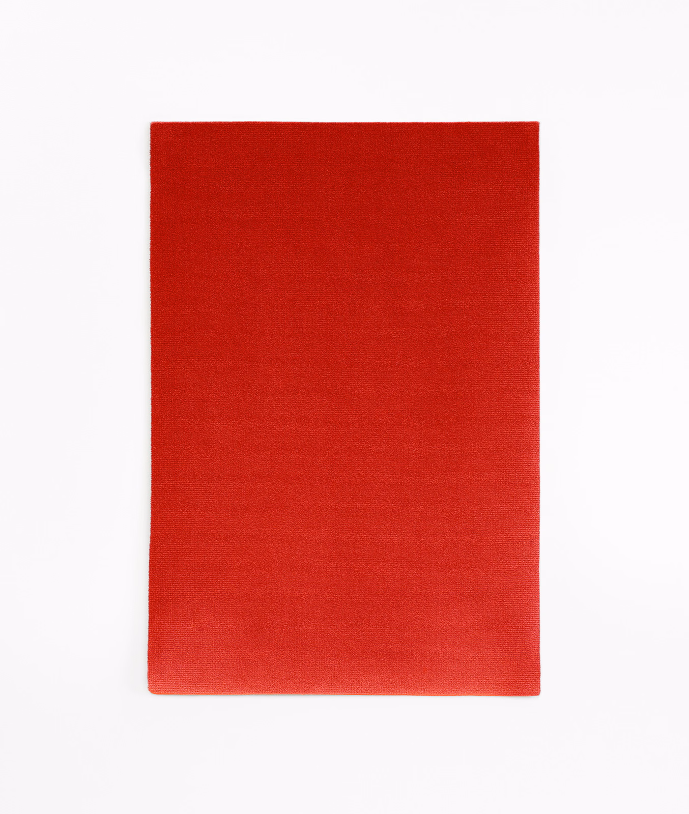 Deep scarlet red velvet swatch showing a smooth, softly shaded pile