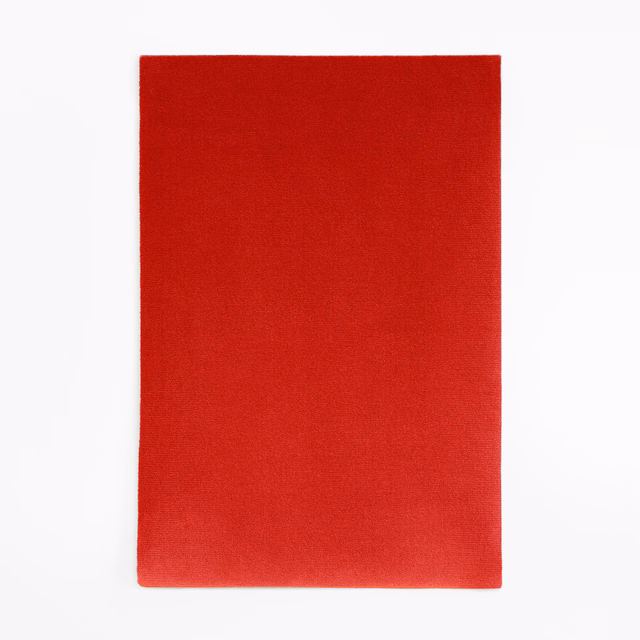 Deep scarlet red velvet swatch showing a smooth, softly shaded pile