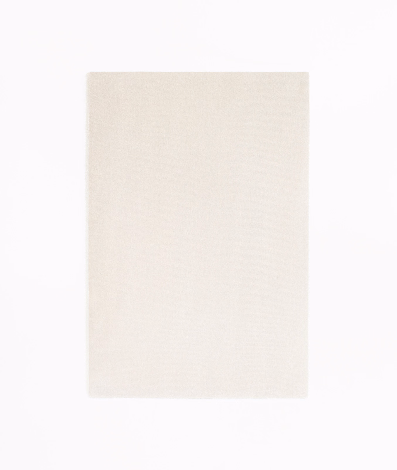 Pale ivory velvet swatch with a softly napped, almost unpatterned surface
