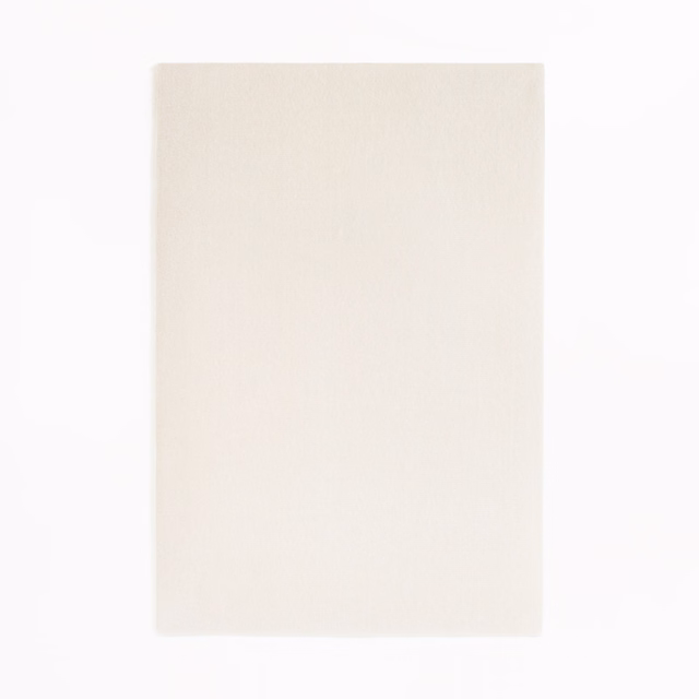 Pale ivory velvet swatch with a softly napped, almost unpatterned surface