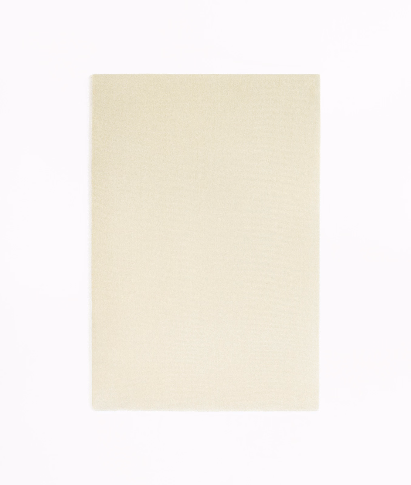 Pale ivory velvet swatch showing a smooth face and subtle brushed light.