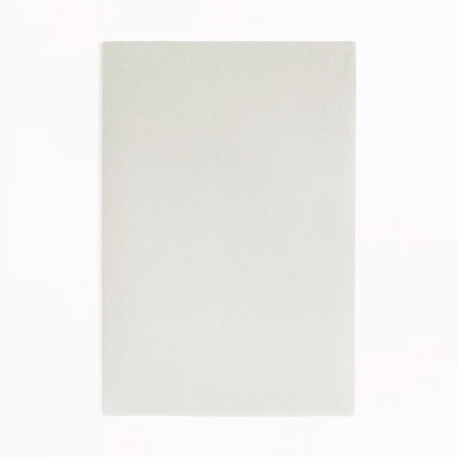 Pale pearl ivory velvet swatch with a softly shaded plain pile