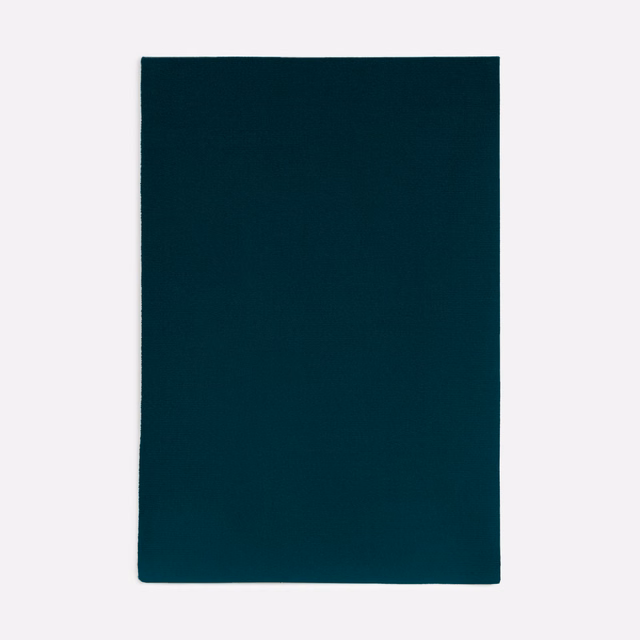 Deep petrol teal velvet swatch showing a plain, softly light-catching surface