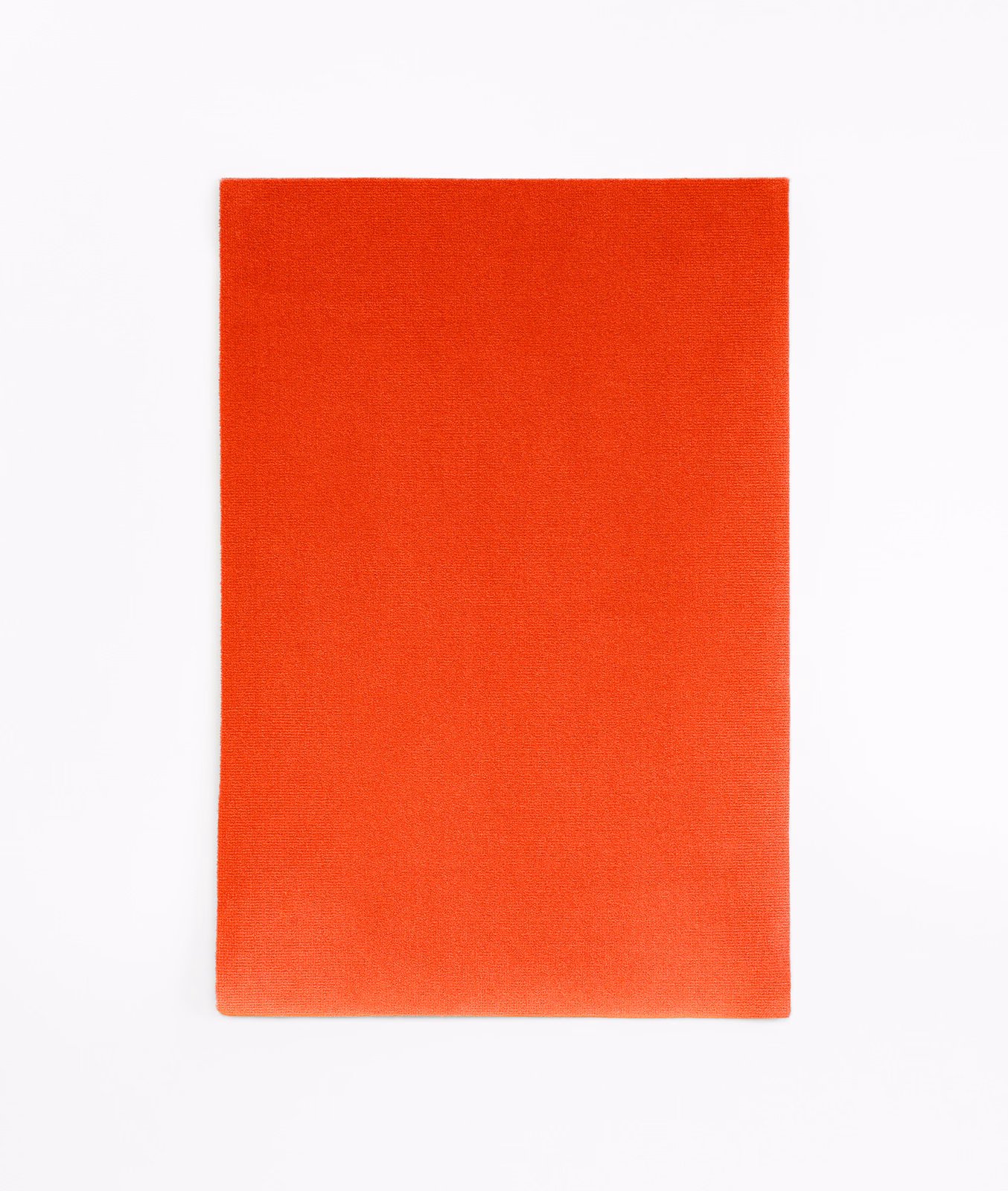 Vivid vermilion-red velvet swatch with a smooth, subtly brushed pile