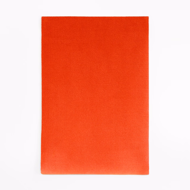 Vivid vermilion-red velvet swatch with a smooth, subtly brushed pile