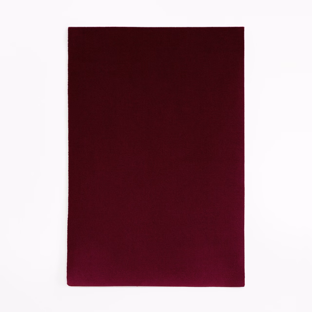 Deep plum burgundy velvet swatch showing a smooth, subtly light-catching pile