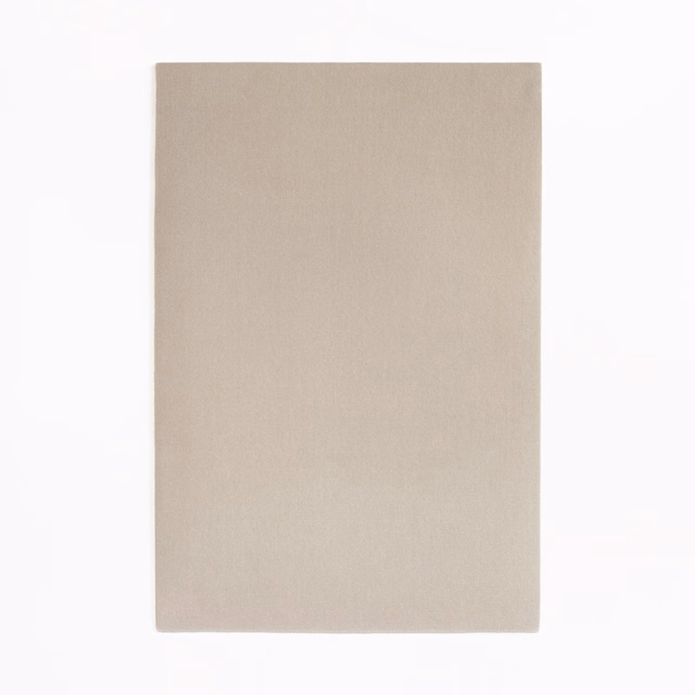 Pale warm taupe velvet swatch with a smooth, subtly brushed plain surface