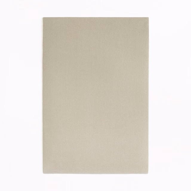 Soft sandy beige velvet with a quiet fine nap and even unpatterned surface