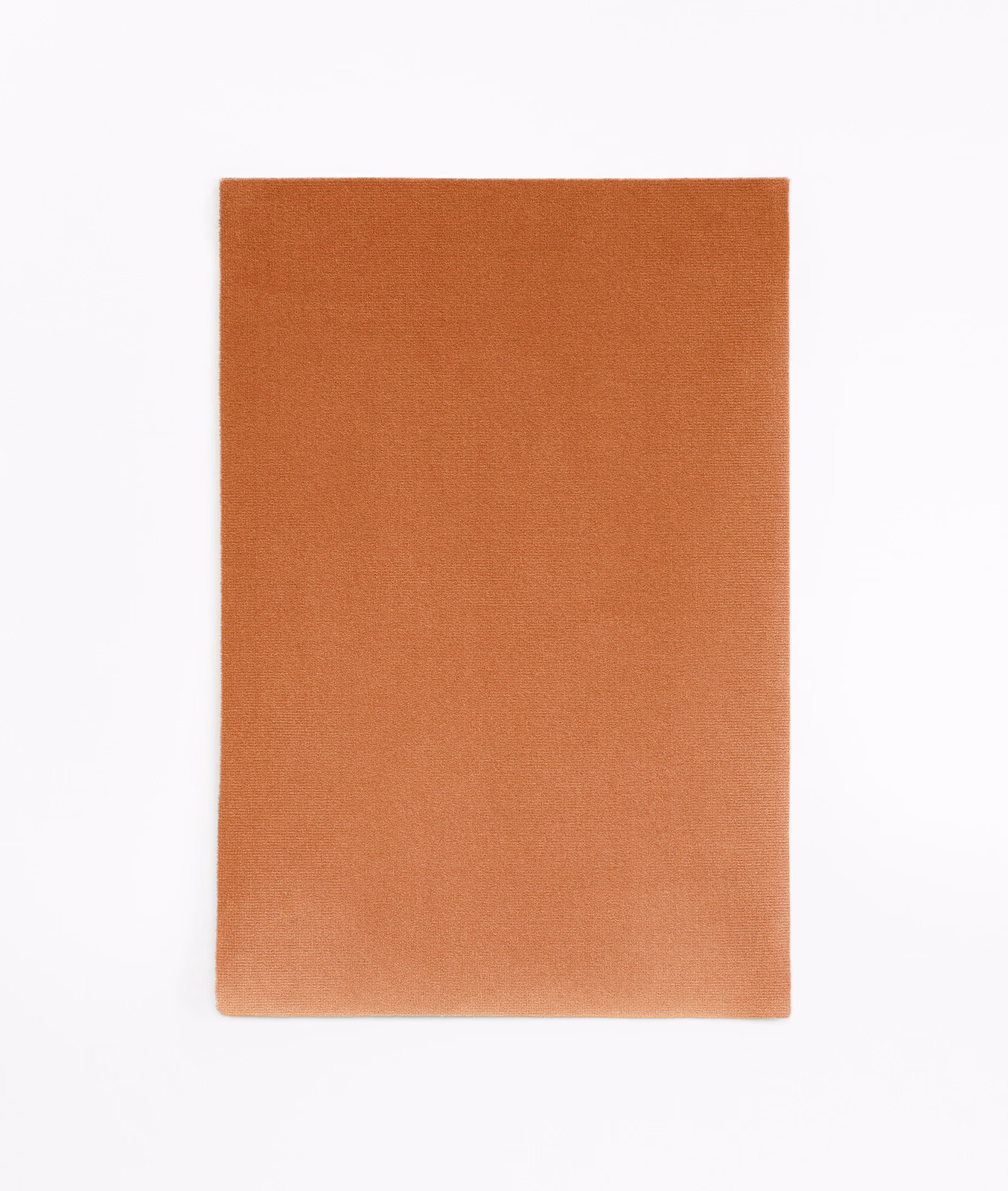 Warm saffron-orange velvet swatch with smooth plain pile and subtle tonal shading
