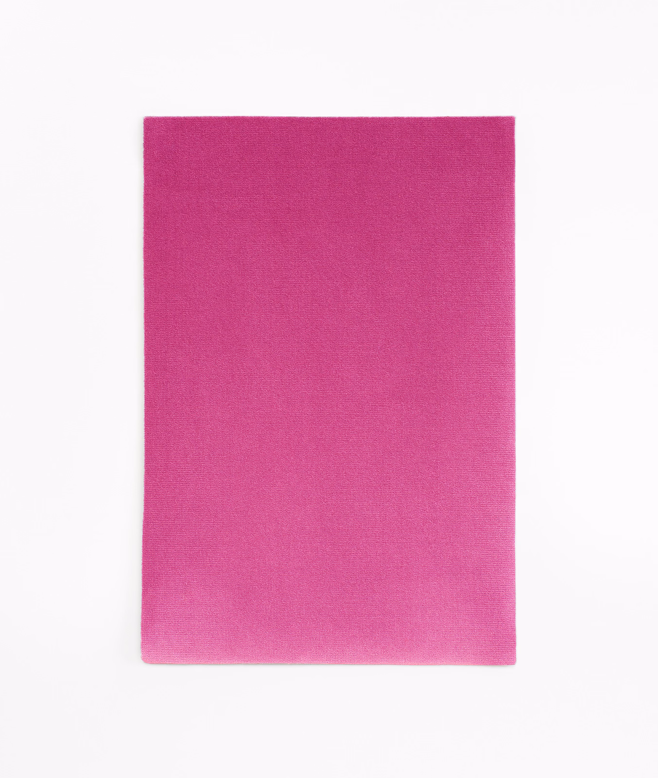 Close-up of vivid shocking magenta pink velvet with a soft, subtly brushed surface