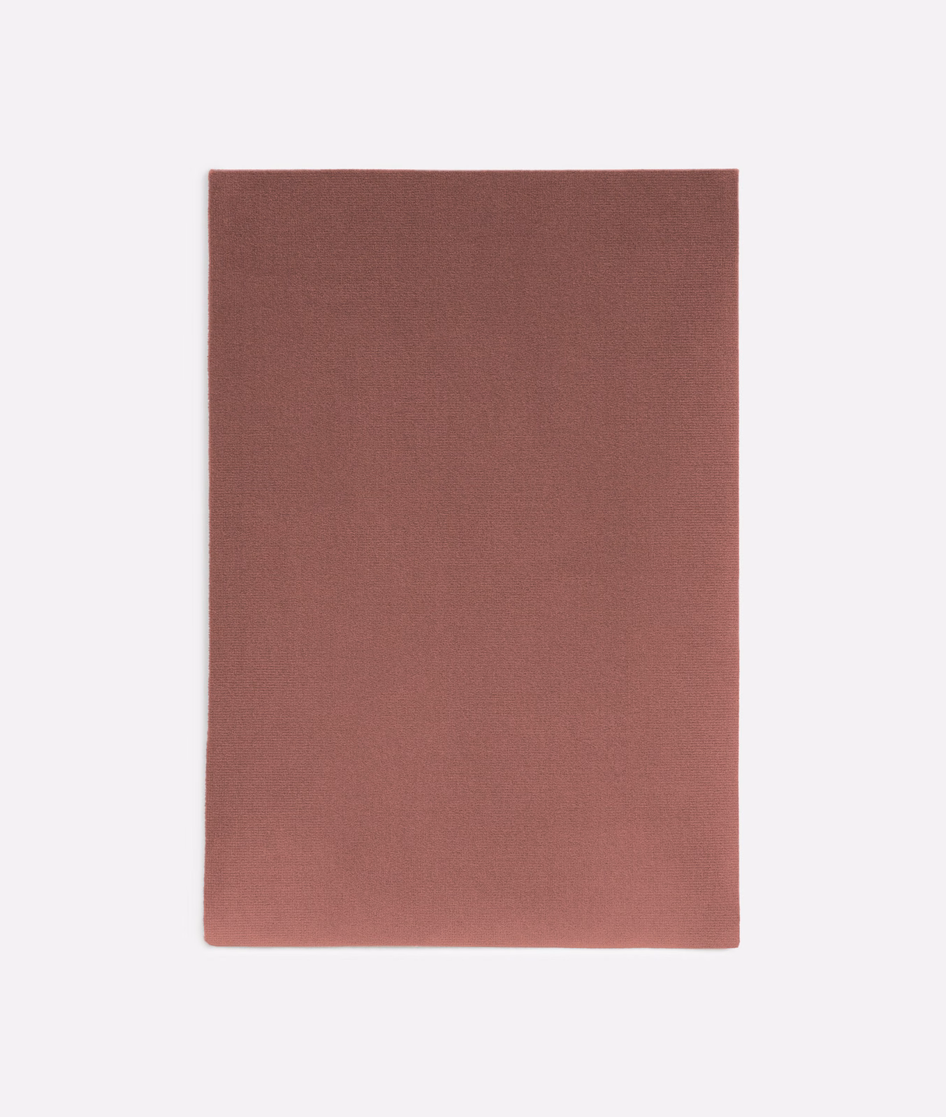 Dusty terracotta rose velvet swatch showing a soft, subtly directional nap