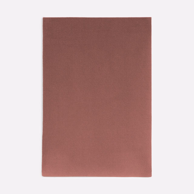 Dusty terracotta rose velvet swatch showing a soft, subtly directional nap