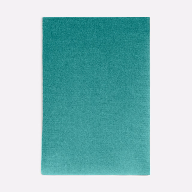 Saturated turquoise velvet swatch showing subtle directional nap and tonal shading